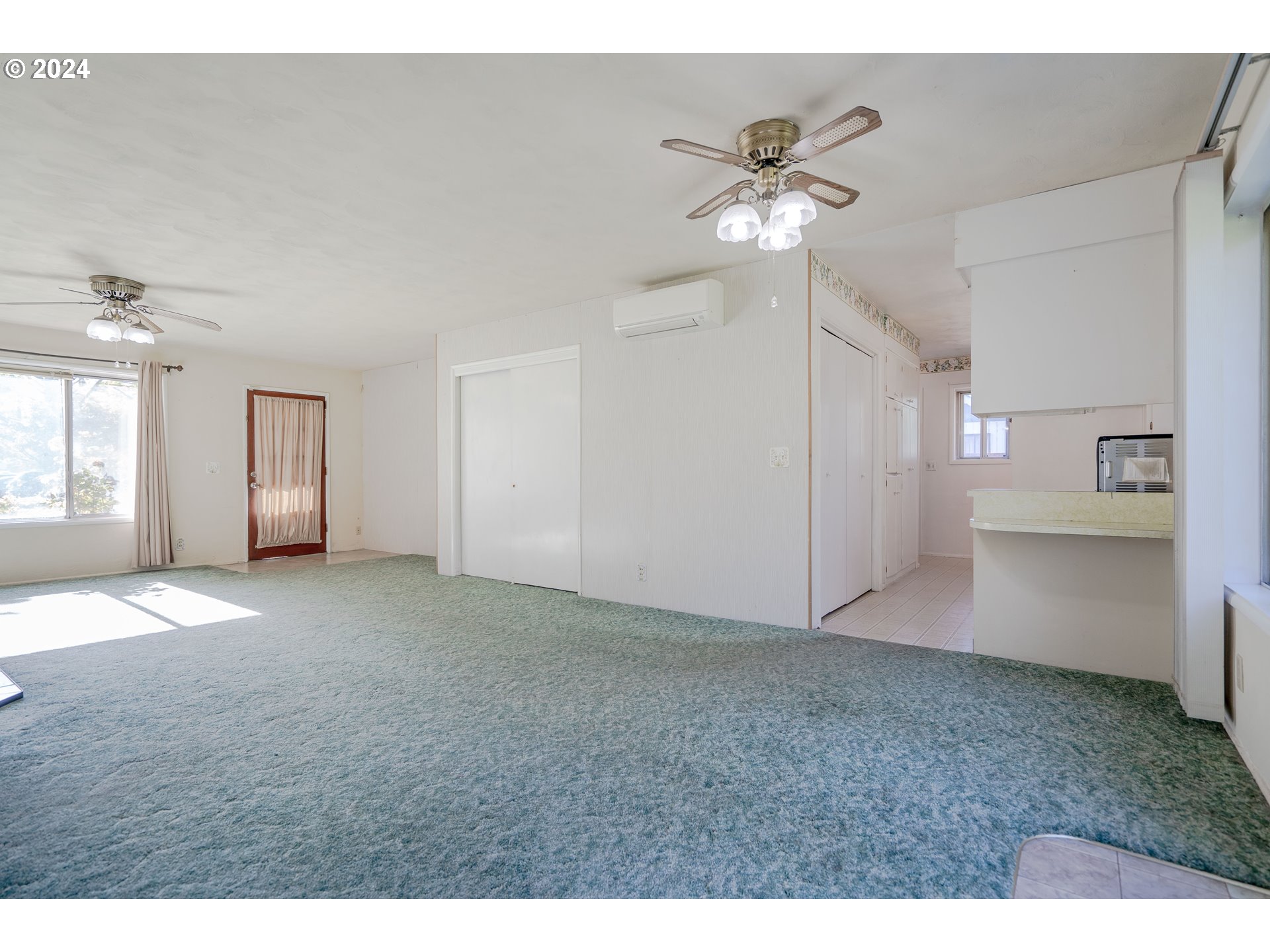 944 Filbert Lane Springfield, OR 97478 - Photo 6 of 24 a view of an empty room with a ceiling fan