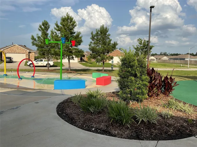 a view of swimming pool with sitting area