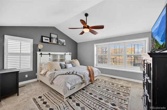 a bathroom with a granite countertop bathtub and shower