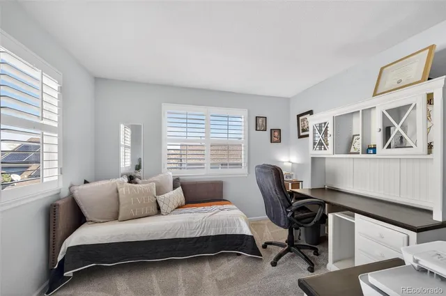a living room with furniture wooden floor and a flat screen tv