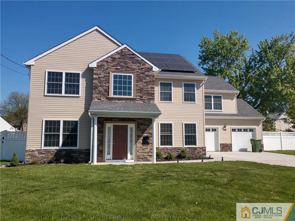68 Ashley Road Edison, NJ 08817 - Photo 1 of 1 a front view of a house with a garden