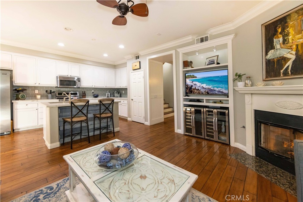 40232 Pasadena Drive Temecula, CA 92591 - Photo 17 of 44 a living room with stainless steel appliances furniture wooden floor and a kitchen view