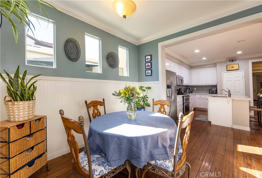 40232 Pasadena Drive Temecula, CA 92591 - Photo 18 of 44 a view of a dining room with furniture and wooden floor