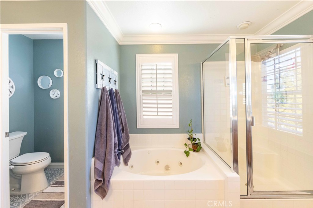 40232 Pasadena Drive Temecula, CA 92591 - Photo 36 of 44 a bathroom with a tub and a shower