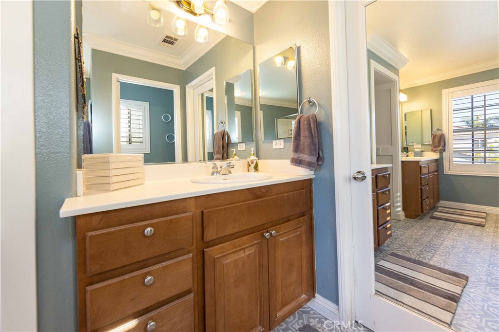40232 Pasadena Drive Temecula, CA 92591 - Photo 37 of 44 a bathroom with a sink double vanity and a mirror