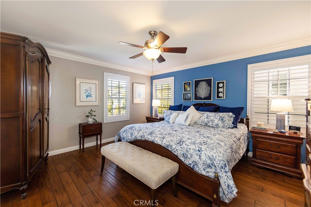 40232 Pasadena Drive Temecula, CA 92591 - Photo 44 of 44 a bedroom with a bed and a dresser with wooden floor