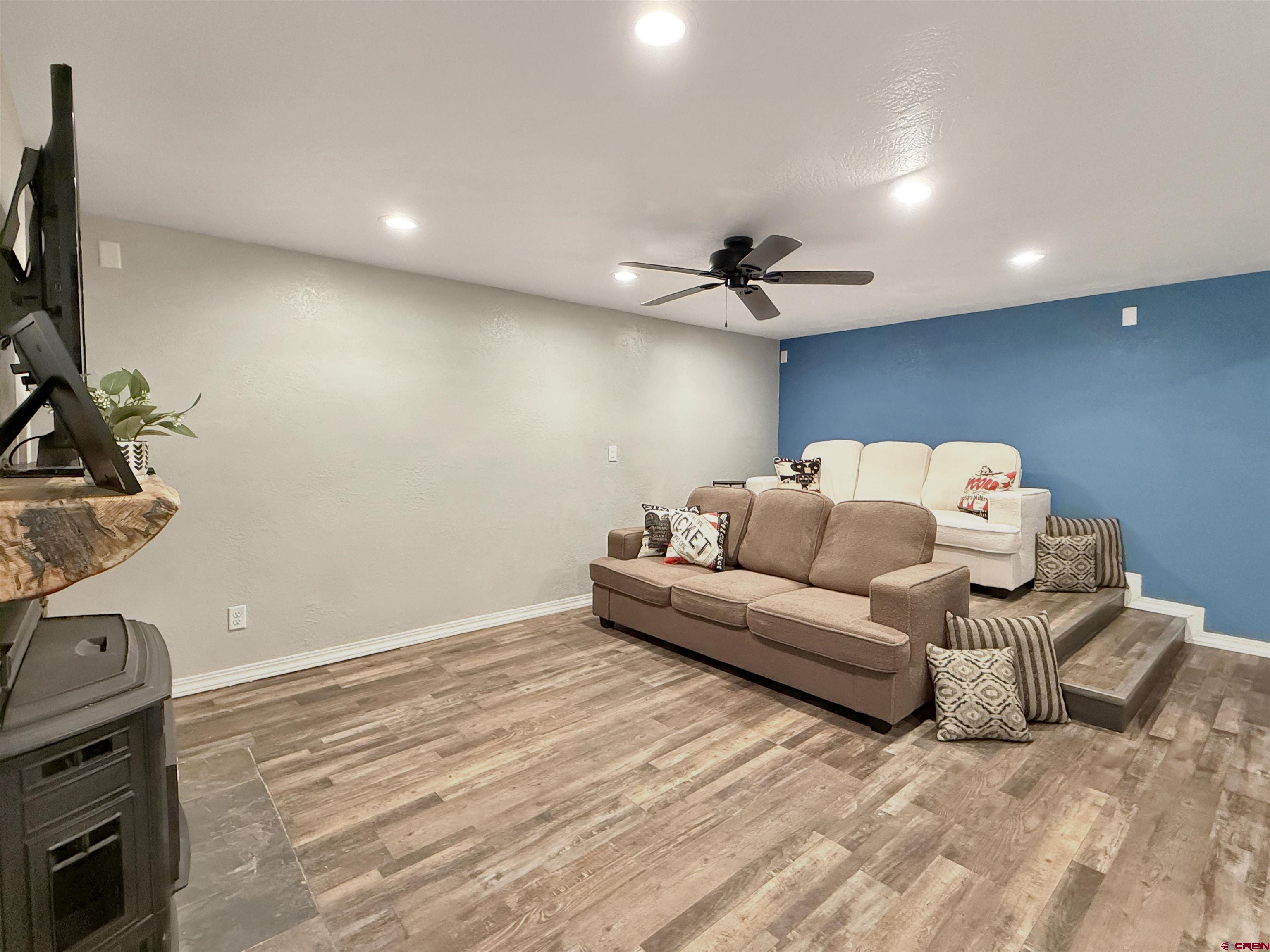 27425 Rd P.7 Dolores, CO 81323 - Photo 32 of 44 a living room with furniture and a flat screen tv