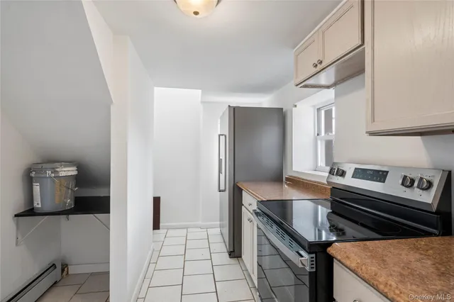 a kitchen with a stove and a refrigerator