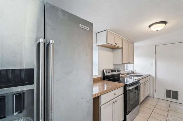 a kitchen with a stove and a refrigerator