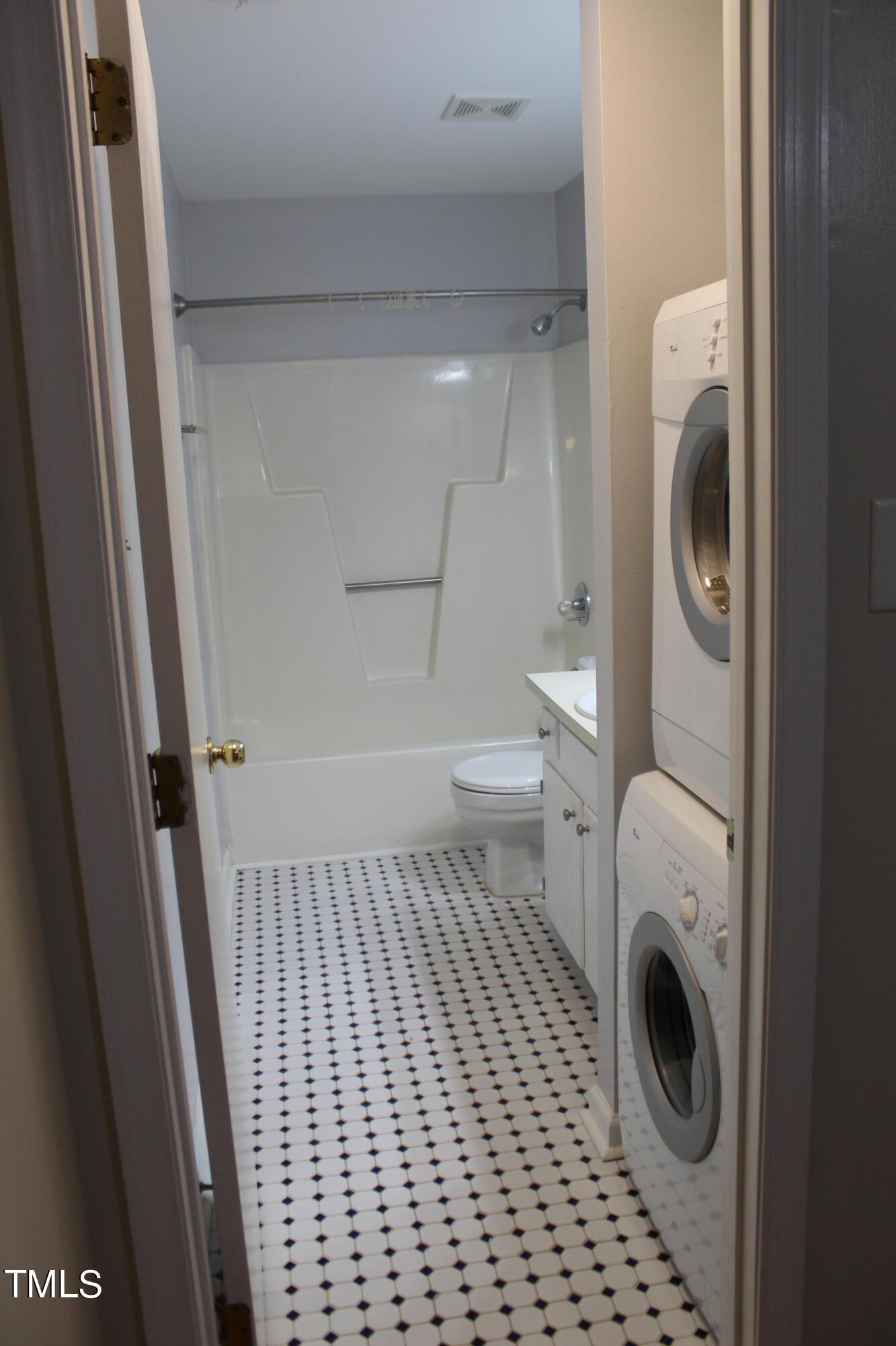 3203 Mill Run, Unit 168 Raleigh, NC 27612 - Photo 38 of 56 a bathroom with a toilet and a washing machine