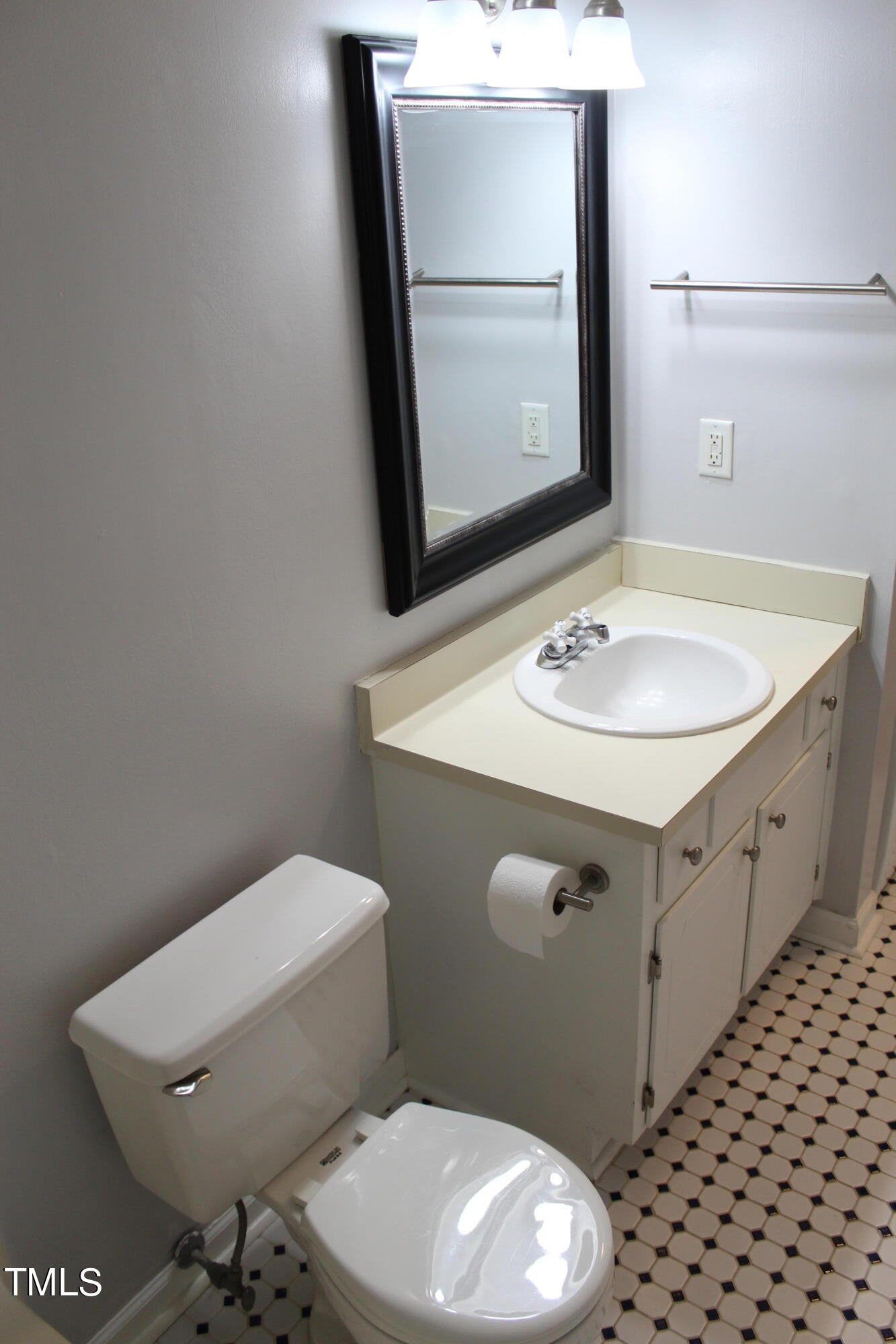 3203 Mill Run, Unit 168 Raleigh, NC 27612 - Photo 40 of 56 a bathroom with a sink toilet and mirror