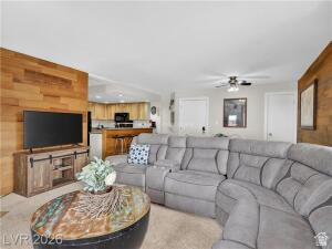 407 South Vasels Road, Unit 49 Brian Head, UT 84719 - Photo 10 of 40 Living room featuring ceiling fan and wooden walls