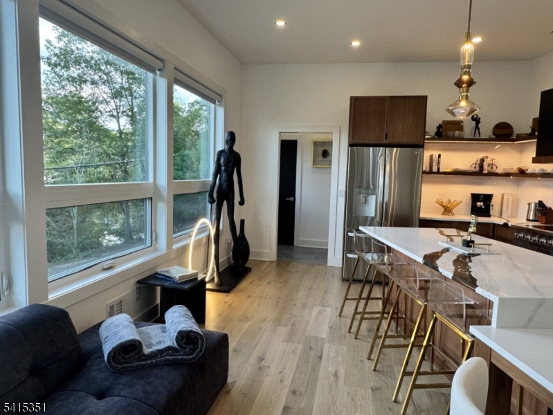301 Kingsland Road Landing, NJ 07850 - Photo 13 of 42 a living room with furniture a floor to ceiling window and stainless steel appliances