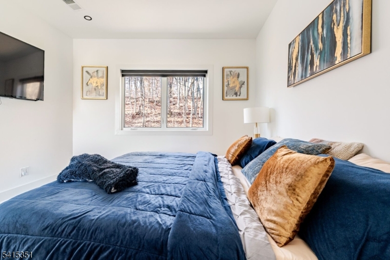 301 Kingsland Road Landing, NJ 07850 - Photo 22 of 42 a bed sitting in a bedroom next to a window