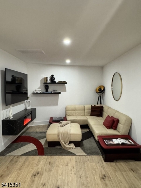 301 Kingsland Road Landing, NJ 07850 - Photo 37 of 42 a living room with furniture and a flat screen tv