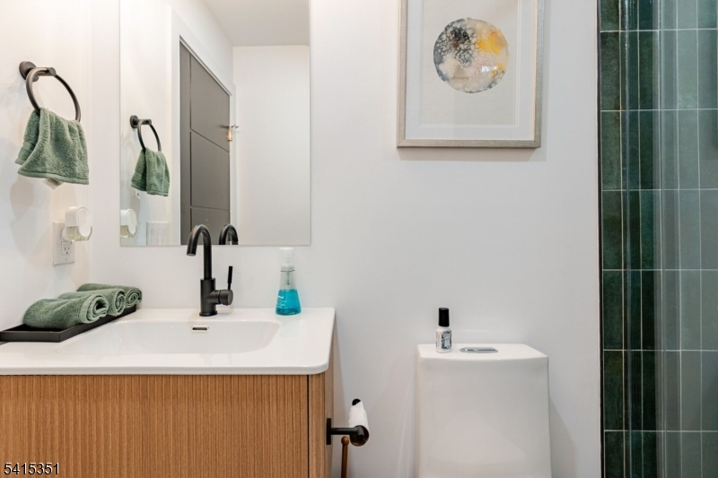 301 Kingsland Road Landing, NJ 07850 - Photo 38 of 42 a bathroom with a sink and a mirror