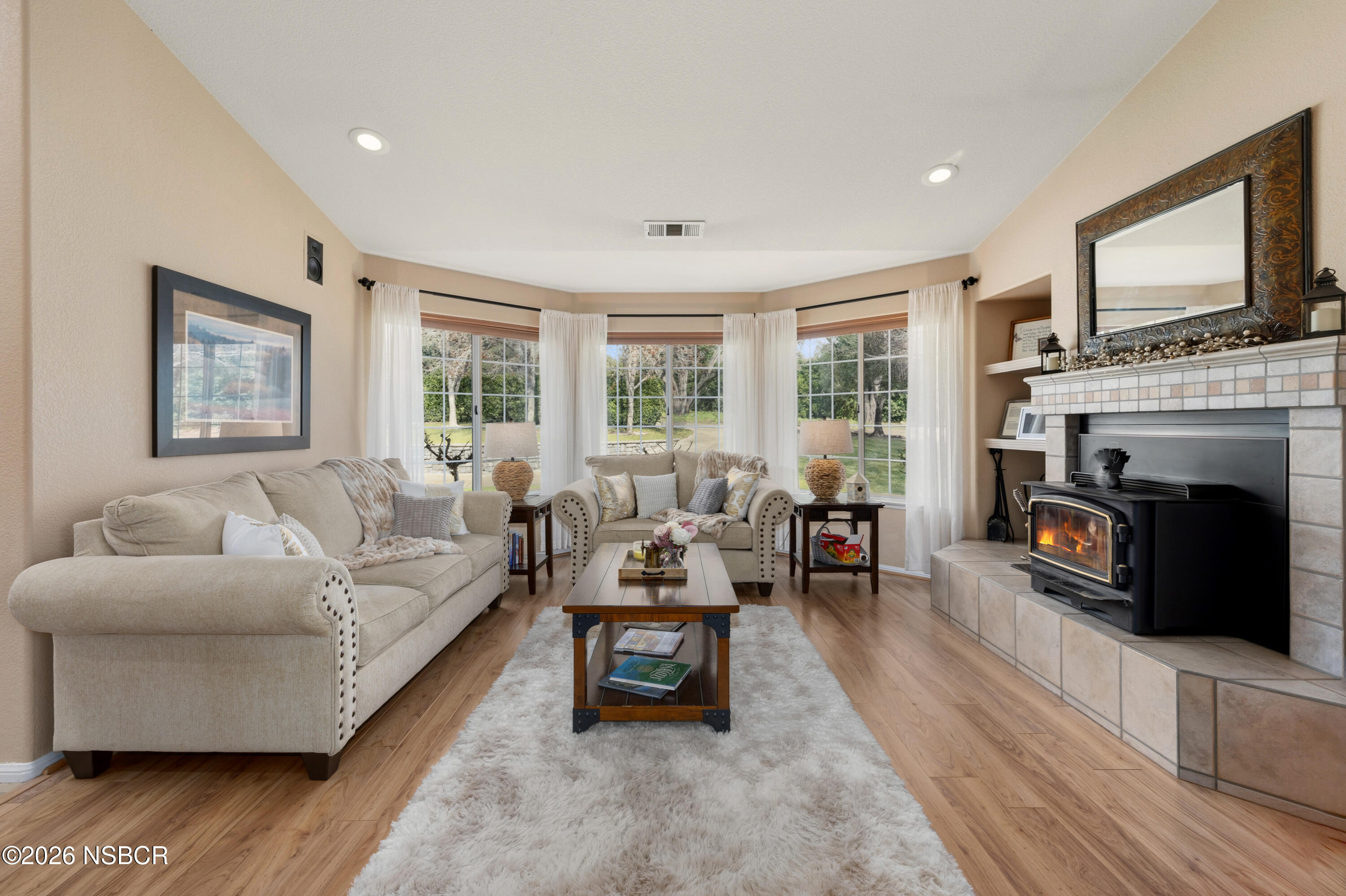 922 College Canyon Road Solvang, CA 93463 - Photo 3 of 23 a living room with furniture flat screen tv and a fireplace