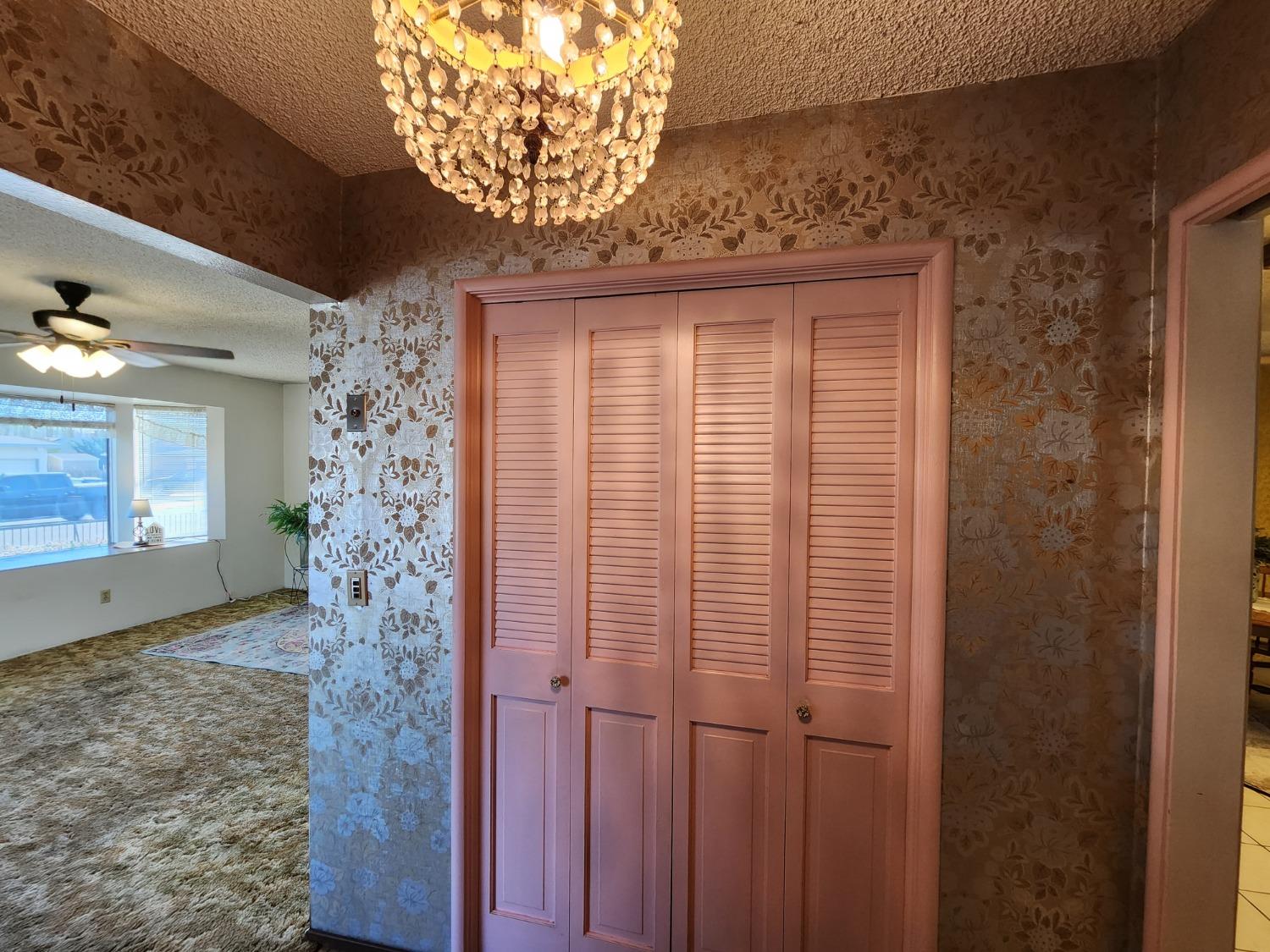 3653 Wright Street Selma, CA 93662 - Photo 12 of 41 a bathroom with a shower curtain and a chandelier