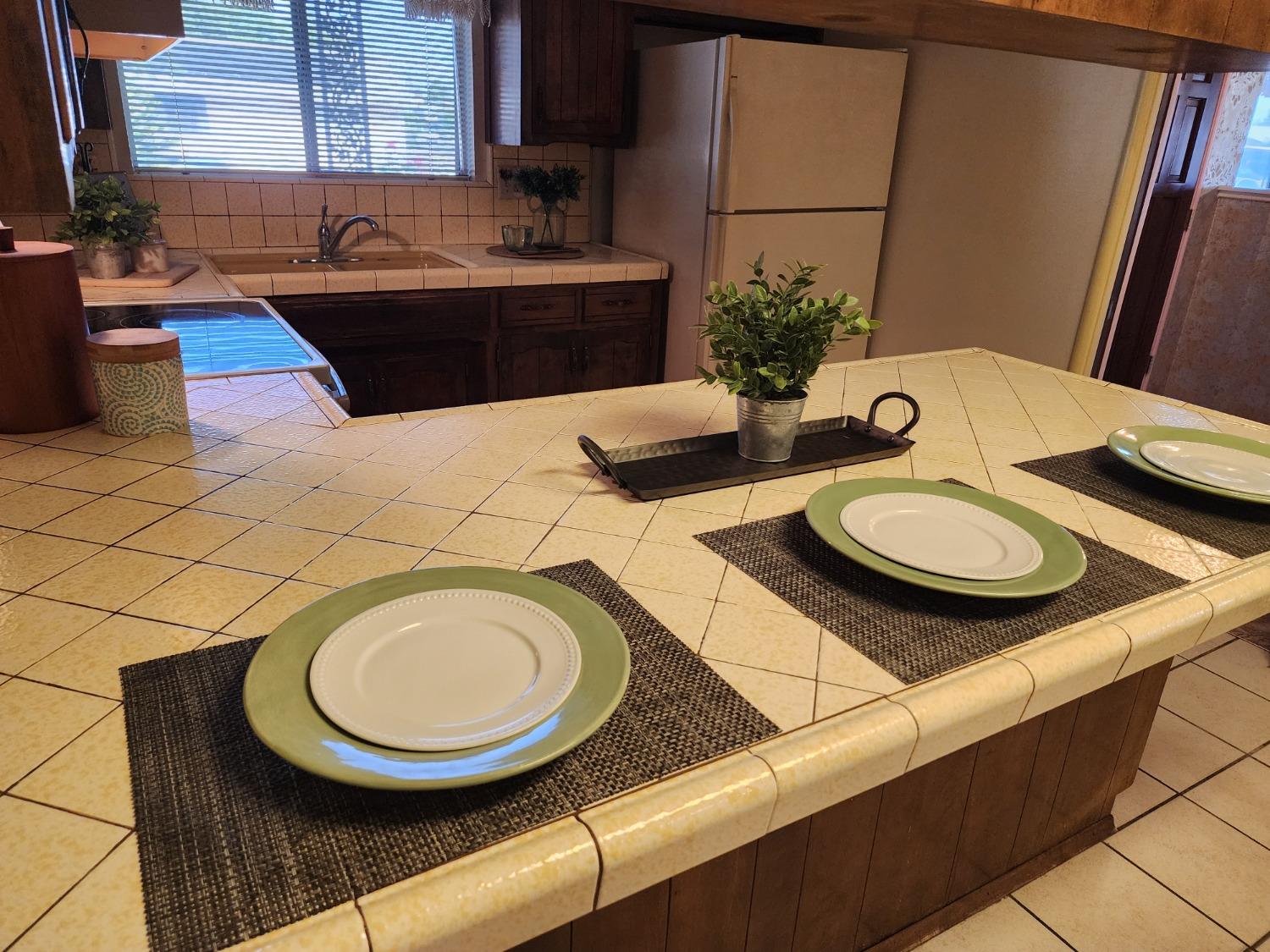 3653 Wright Street Selma, CA 93662 - Photo 22 of 41 a kitchen with a sink and a stove