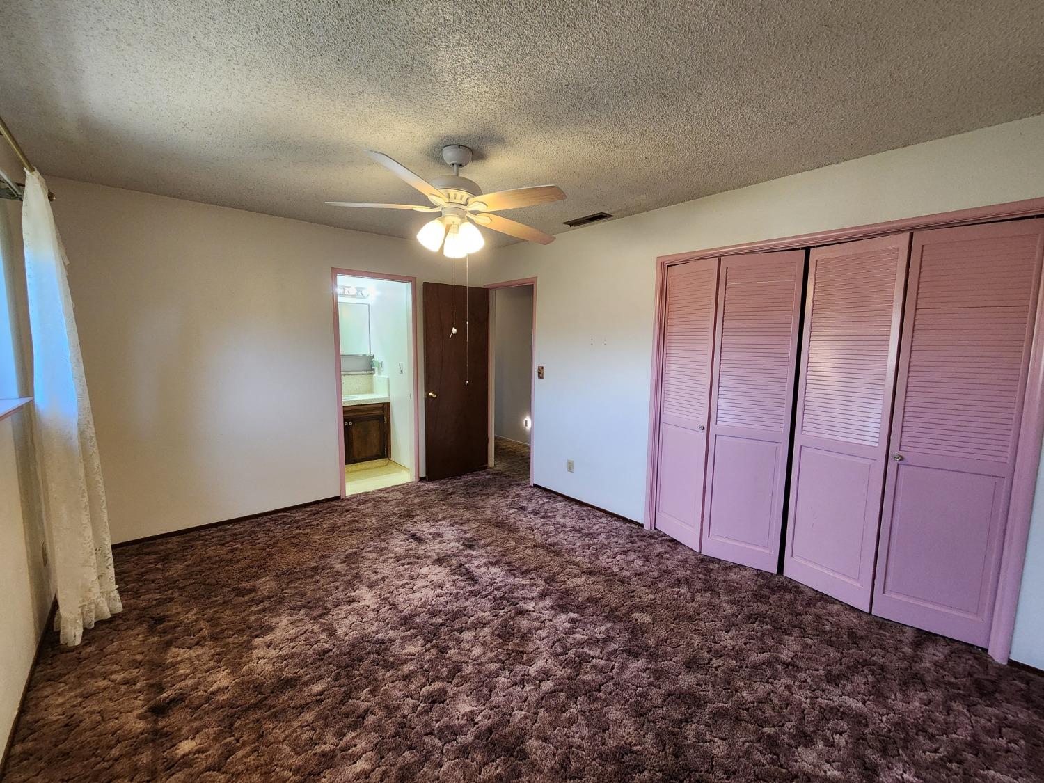 3653 Wright Street Selma, CA 93662 - Photo 32 of 41 an empty room with a ceiling fan and entryway
