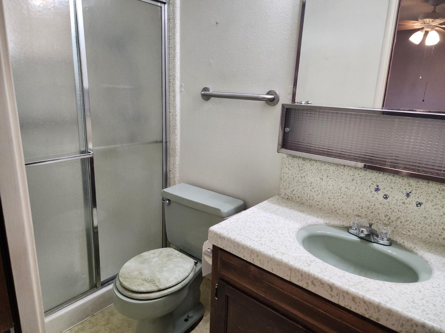 3653 Wright Street Selma, CA 93662 - Photo 34 of 41 a bathroom with a sink and a toilet