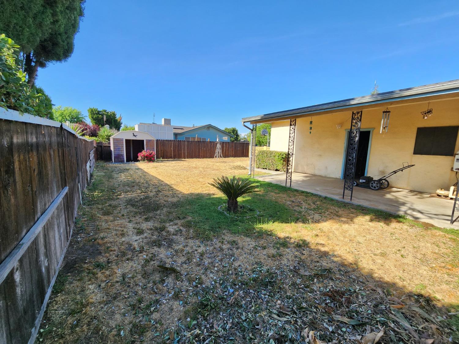 3653 Wright Street Selma, CA 93662 - Photo 38 of 41 a view of backyard with wooden fence