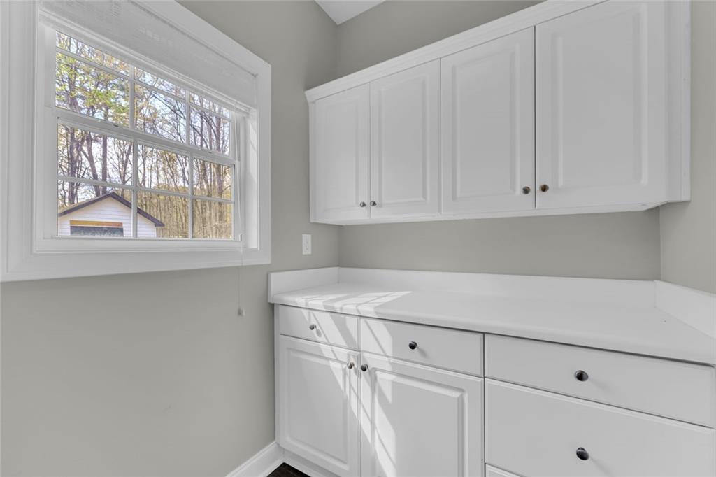 857 Cooper Road Social Circle, GA 30025 - Photo 18 of 88 a view of cabinets with window