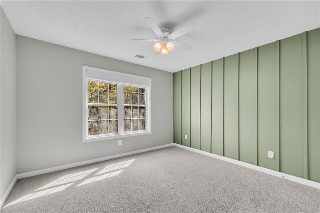857 Cooper Road Social Circle, GA 30025 - Photo 32 of 88 a view of an empty room with a window