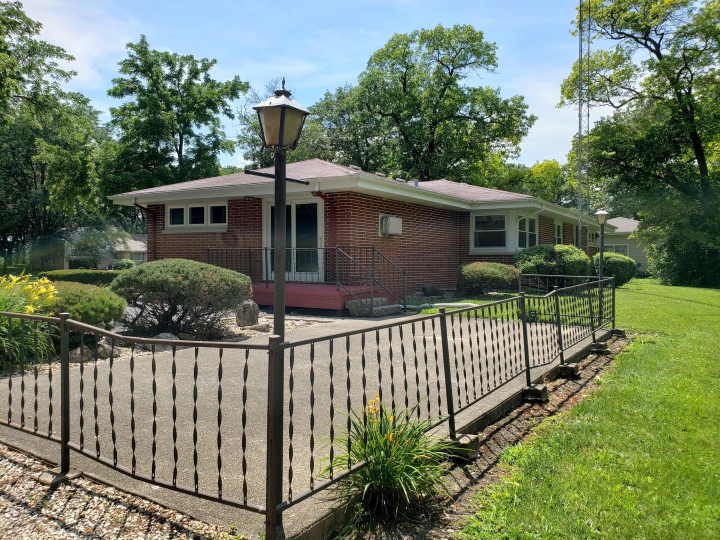 21102 Robin Road Harvard, IL 60033 - Photo 20 of 21 a view of a house with wooden fence next to a yard