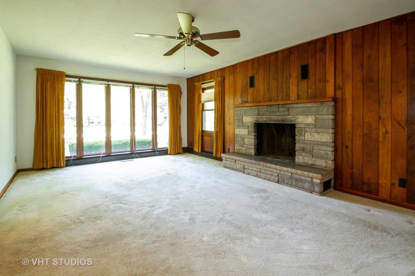 21102 Robin Road Harvard, IL 60033 - Photo 7 of 21 a view of an empty room with a fireplace and a window