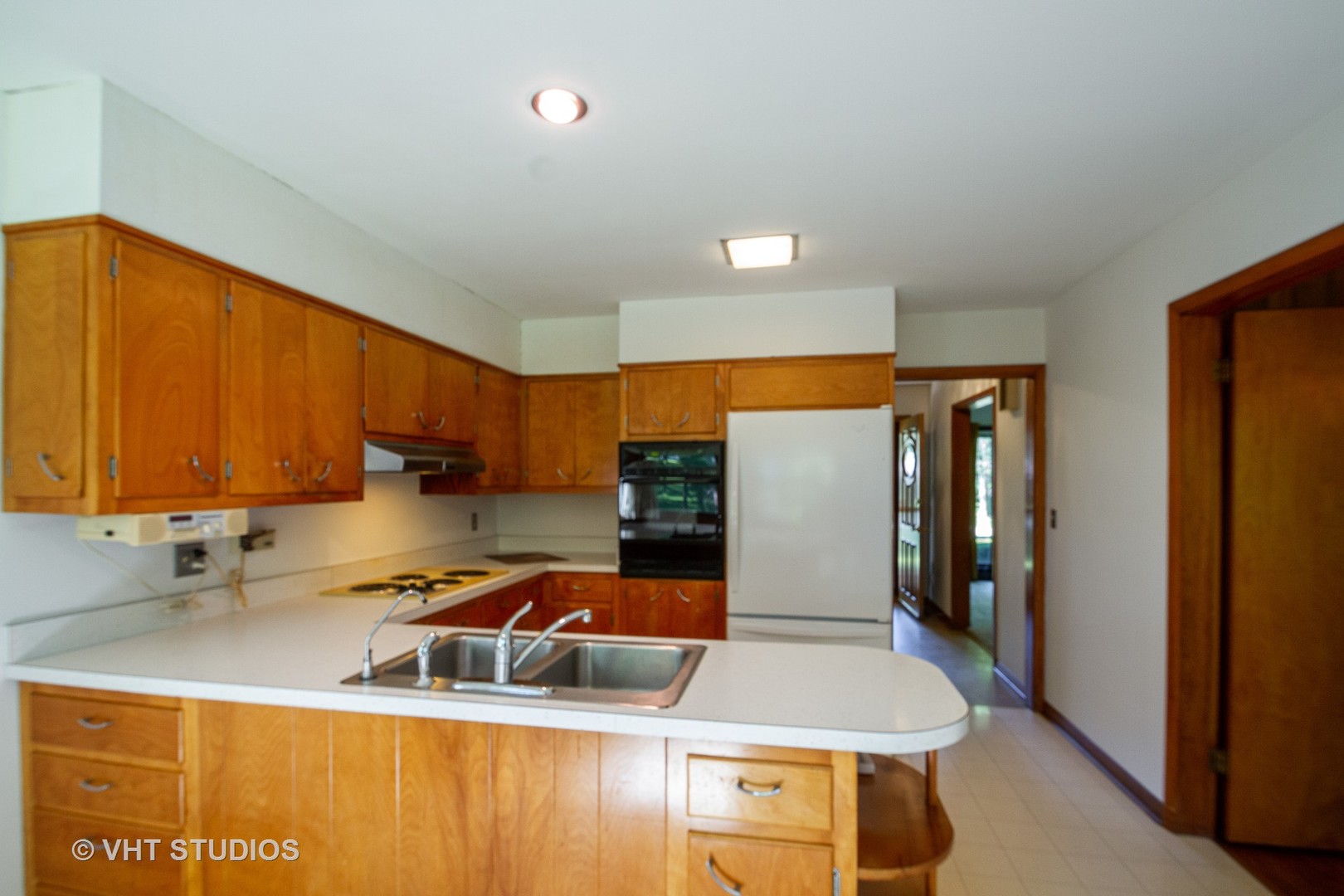 21102 Robin Road Harvard, IL 60033 - Photo 8 of 21 a kitchen with stainless steel appliances granite countertop a sink a stove and a refrigerator