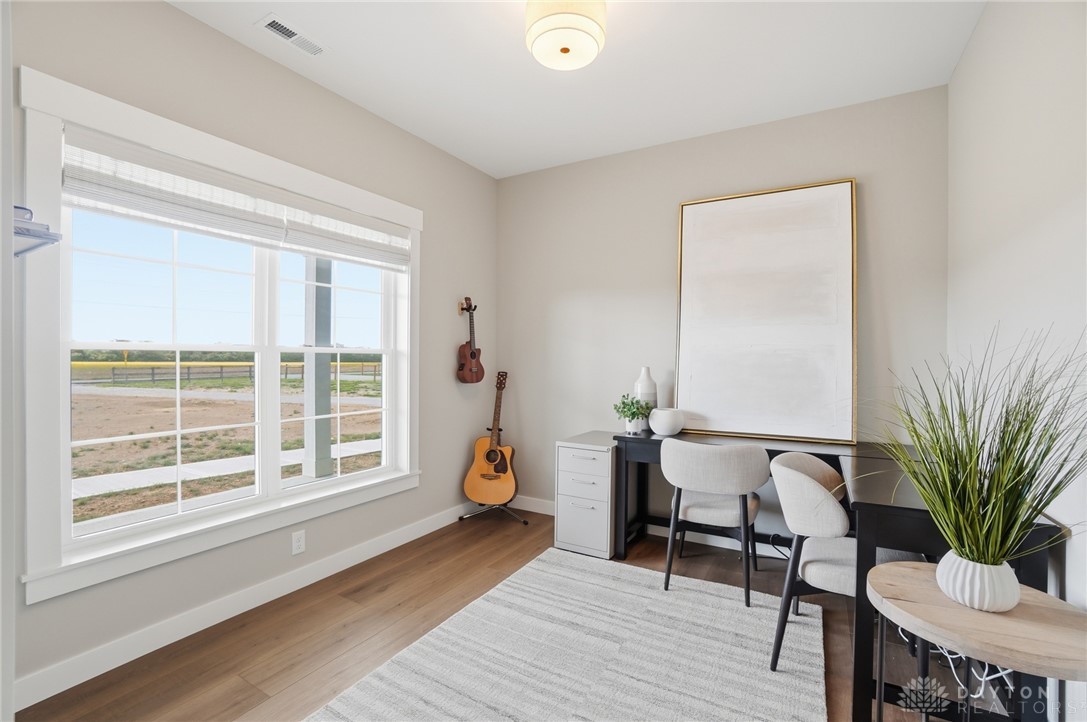 9364 Kenrick Road Dayton, OH 45458 - Photo 5 of 62 This versatile room features hardwood floors and ample natural light, ideal for a home office or creative space.