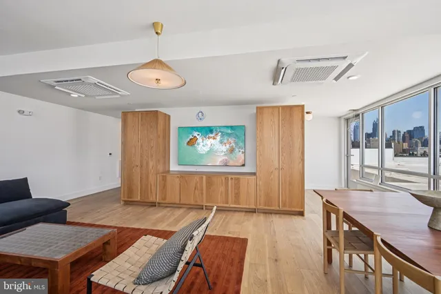 a view of a livingroom with furniture and window