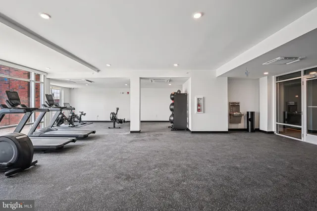 a view of a livingroom with furniture and a ceiling fan