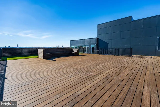 a space with wooden floor and city view