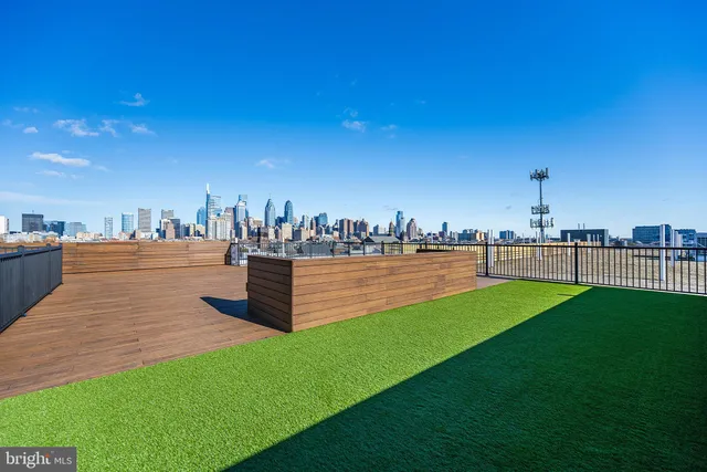 a swimming pool with outdoor seating and yard