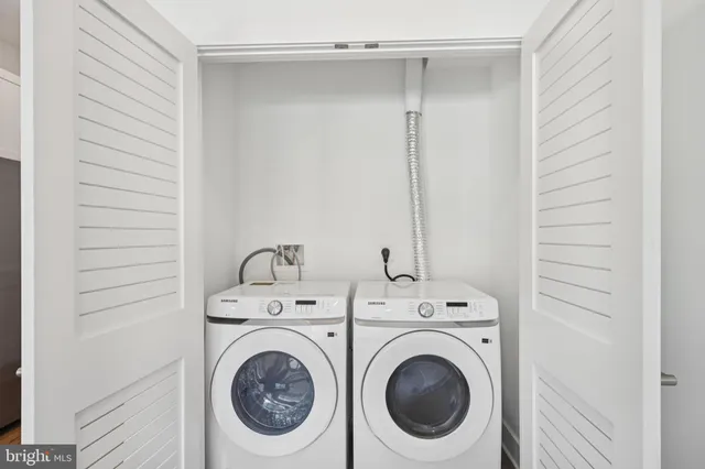 a utility room with dryer and washer