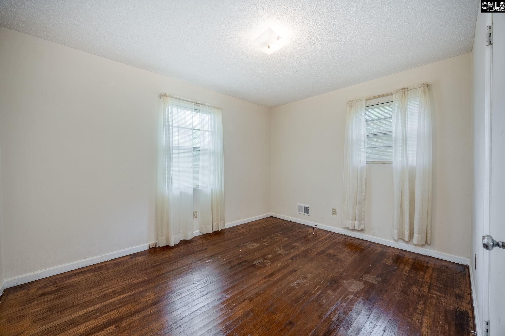 5666 Middleton Court Columbia, SC 29203 - Photo 33 of 42 an empty room with wooden floor and windows