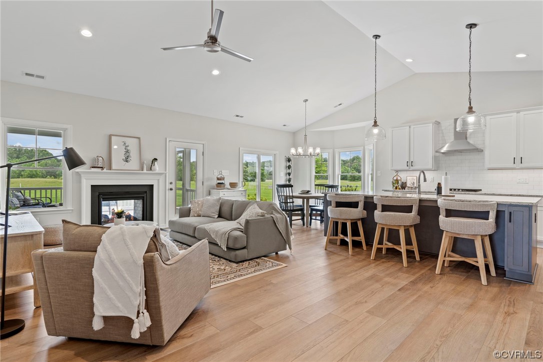 Tbd Atlee Road Mechanicsville, VA 23116 - Photo 12 of 32 Living room with ceiling fan with notable chandeli