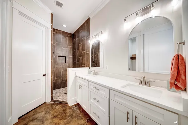 a spacious bathroom with a double vanity sink mirror and double