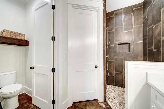 a bathroom with a shower and a toilet