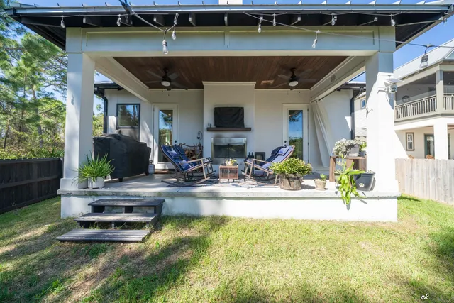 a view of a swimming pool with potted plants