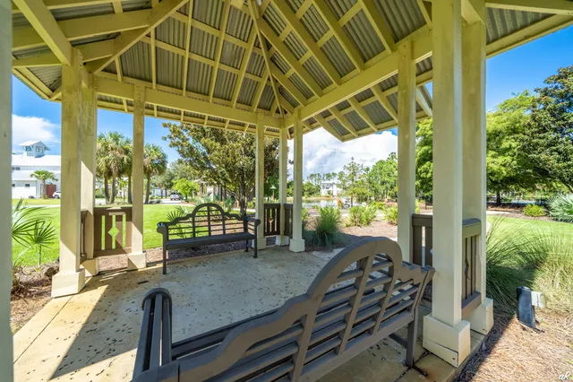 a patio with a yard table and chairs