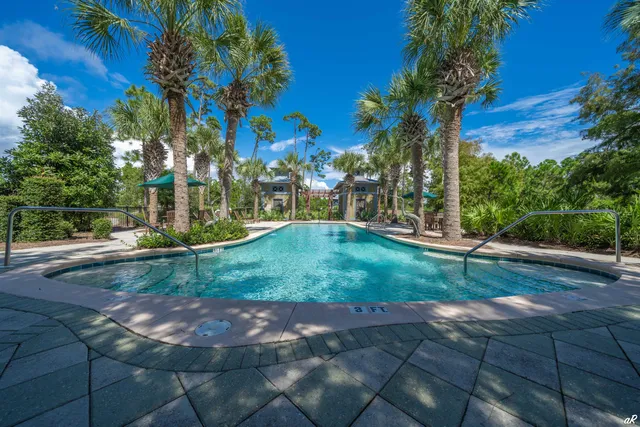 a sign that is sitting in front of flowers