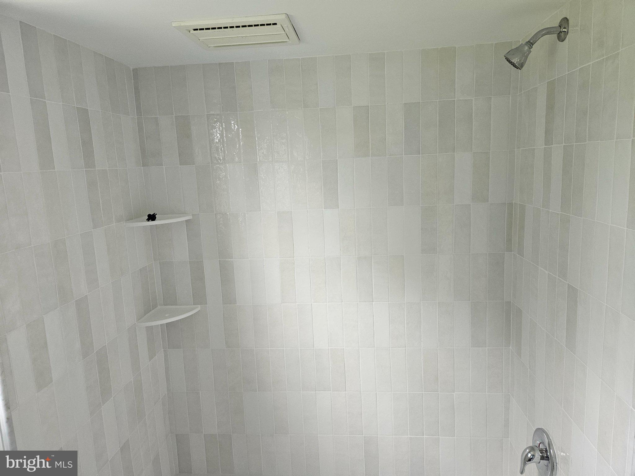 1255 Eagle Road West Chester, PA 19382 - Photo 14 of 15 Sleek, modern shower with elegant tiles.