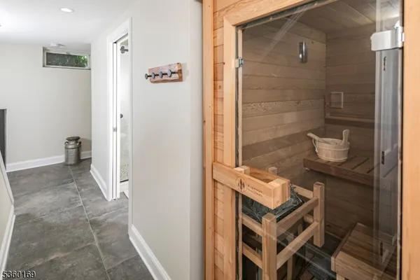 a bathroom with a granite countertop shower