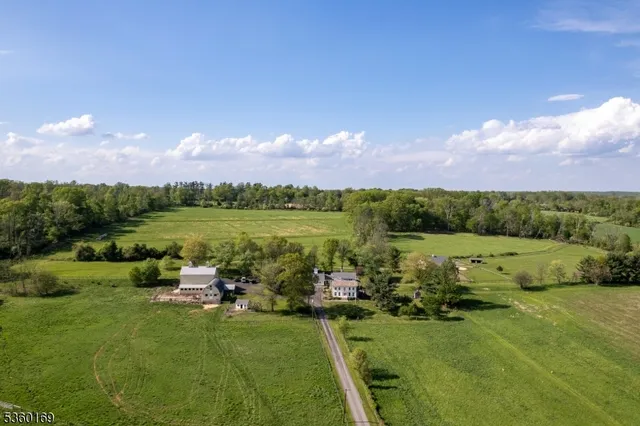 a view of a lake with houses in the back