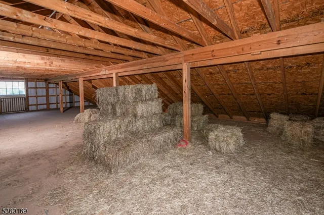 a view of a room with wooden ceiling