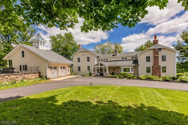 a front view of a house with a yard and porch