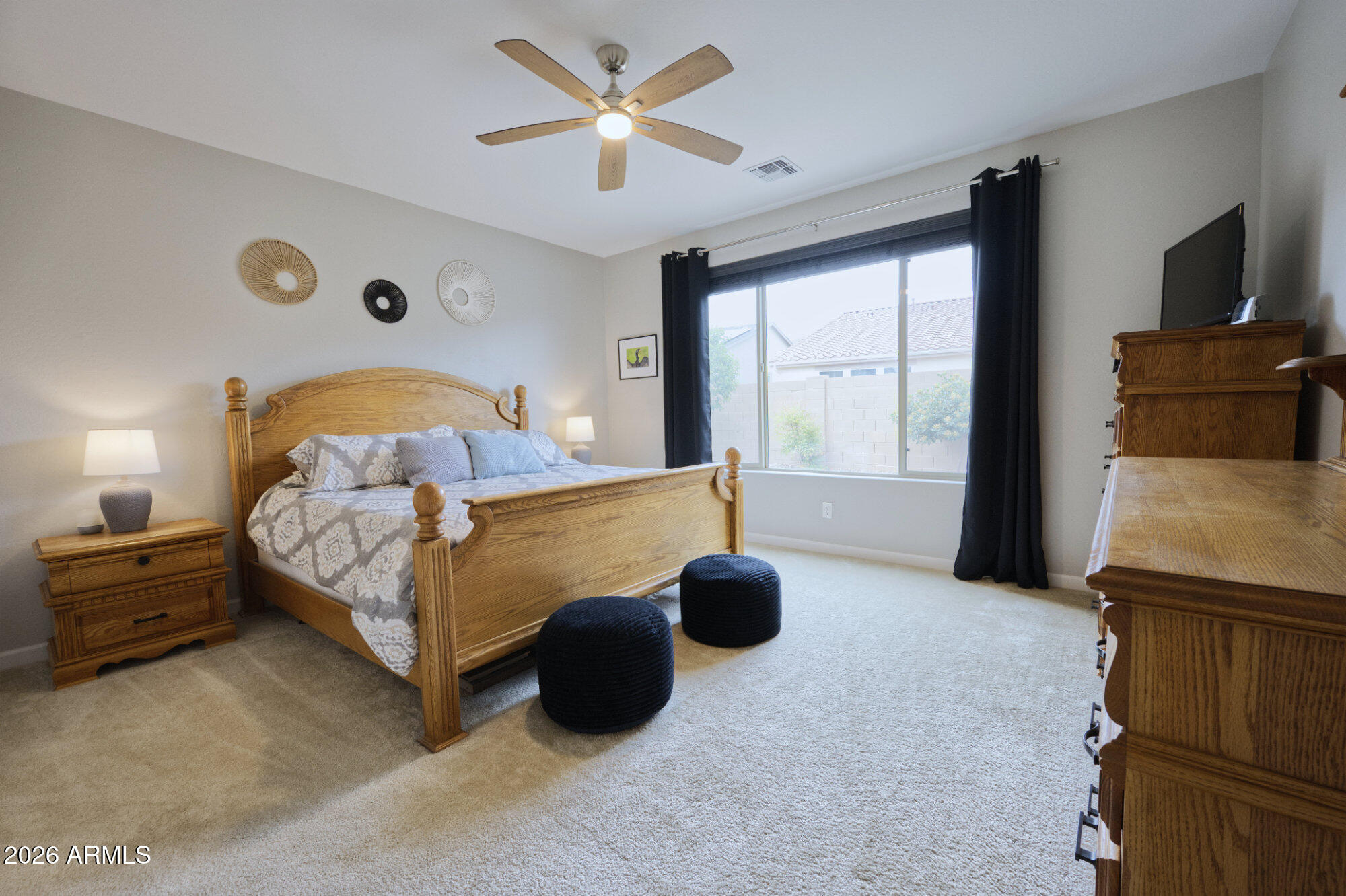 576 Whistle Stop Road Clarkdale, AZ 86324 - Photo 14 of 50 a bedroom with a bed and a chandelier